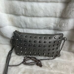 Traci Lynn Gun metal gray crossbody/Clutch handbag with studs accents.